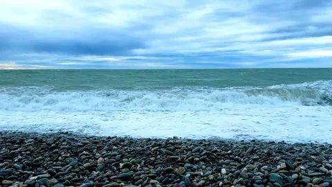 The ocean is calm and the sky is cloudy 스톡 동영상 269868956