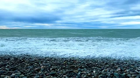 The ocean is calm and the sky is cloudy 스톡 동영상 271080075