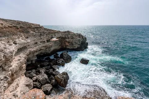 The ocean is calm and the sky is cloudy. The water is a deep blue color. The Stock Photos