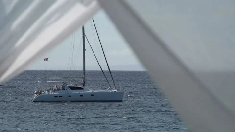 Ocean Catamaran seen through white window sheers. Stock Footage 135236819