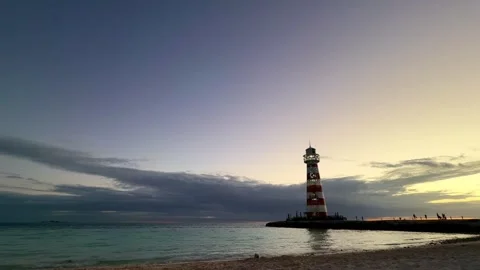 Ocean Cay lighthouse standing tall during sunset in Bahamas Vídeo Stock 330894083