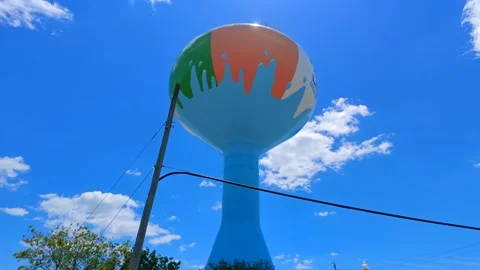 Ocean City water tower on blue sky low motion orbit video Stock Footage 337917548