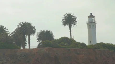 Ocean Cliff Lighthouse Zoom Out Stock Footage 79032083