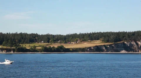 Ocean cliffs and boat pass Video stock 27881375