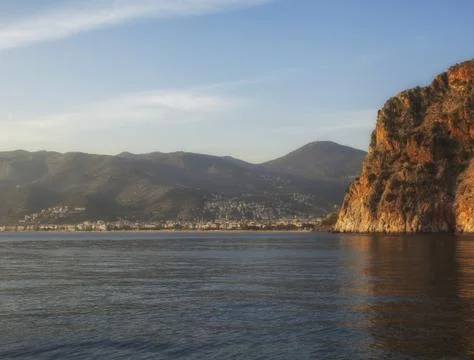 Ocean with cliffs and mountain view Stock Photos