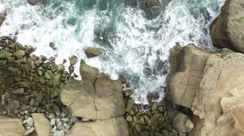 Ocean Cliffs Drone Rise with spin Stock Footage 62392966