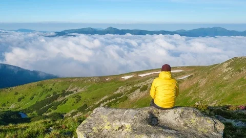The ocean of clouds overflows in a mountain valley Video stock 105851022