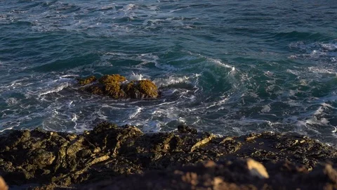 Ocean coast with rocks and waves at sunrise. Beautiful seascape Stock Footage 126039960