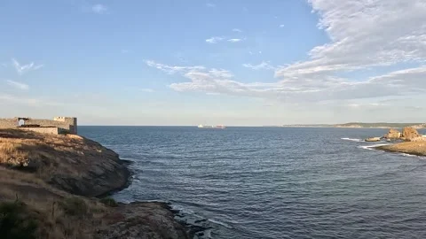 Ocean Coast Skyline Clouds And Cargo Ship Background Stock Footage 339966911