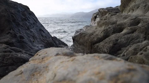 Ocean crashing onto rocks Stock Footage 95417545
