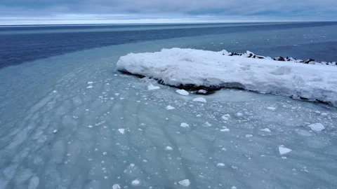 Ocean currents create slush rings with ice-filled ocean water. Stock Footage 303677304