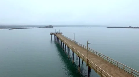 Ocean dock with a lighthouse in background Stock Footage 52137921