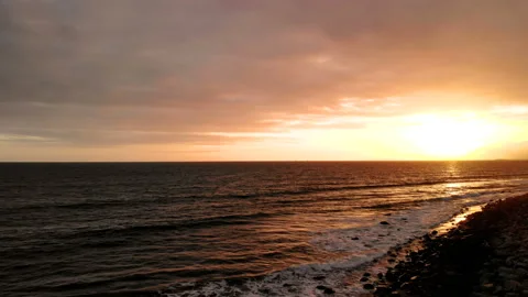 Ocean during sunset. Coast, sky, water, sun Stock Footage 94390114