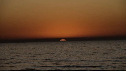 The ocean eating the sun Stock Footage 123201609