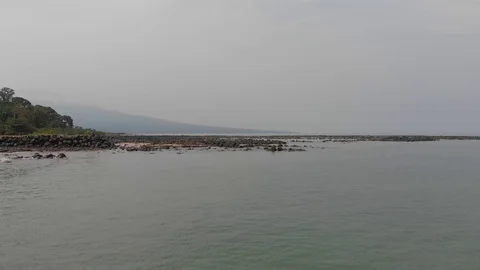 Ocean by equatorial forest with beautiful sandy beach on Bioko Island Stock Footage 129940636