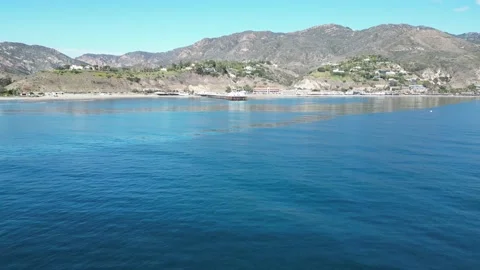Ocean flying toward and over the Malibu Pier Stock Footage 223757568