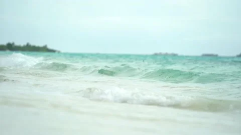 Ocean foam being washed up on the beach after a storm. Tropic island in Pacific Video stock 166552773