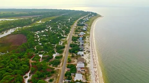 Ocean front lagoon flyover on a calm, cloudy day Stock-Footage 54941976