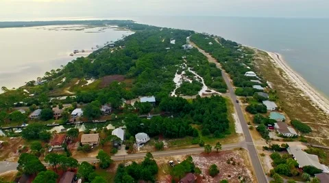 Ocean front lagoon flyover on a calm, cloudy day Video stock 54943981