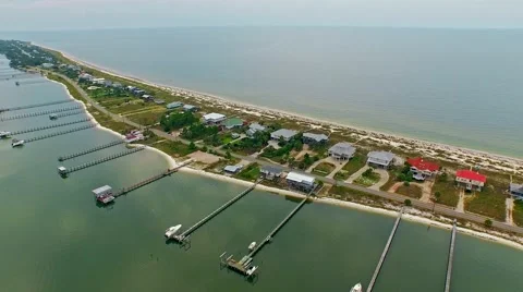 Ocean front lagoon flyover on a calm, cloudy day Video stock 54944796