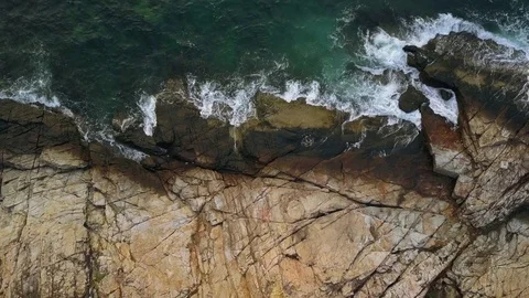 Ocean Green Waves breaking at the old rocks. Power in Nature. Seascape AERIAL Stock Footage 81329446