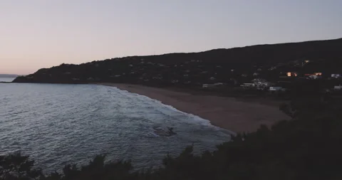 Ocean hitting the shore in a dusk light Stock Footage 203588420