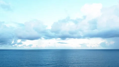 Ocean horizon background under a bright sky with dramatic cumulus storm clouds Stock Footage 346556271