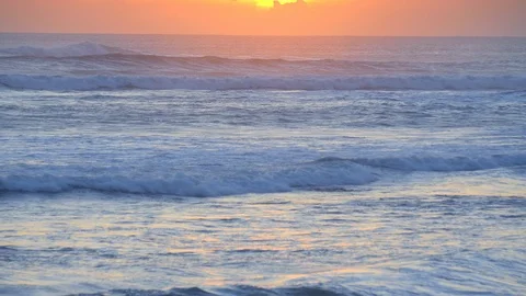 Ocean with huge tide waves and beautiful yellow sunset sky Video stock 113631313