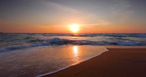 Ocean island beach sunrise. Waves splash on the shore Stock Footage 140479218