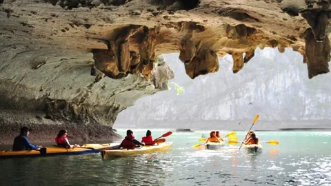 Ocean Kayakers Emerge From Cave into Ocean Cinemagraph Stock Footage 166344389