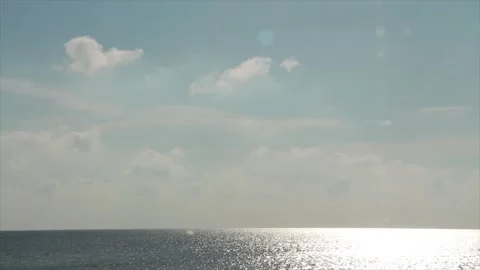 Ocean lake water with bright sun shining on it during daytime with clouds sky Stock-Footage 252152235