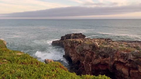 Ocean landscape with waves and rocks at sunset Stock Footage 218982166