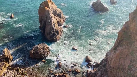 Ocean landscape with waves and rocks at sunset Stock Footage 232046610