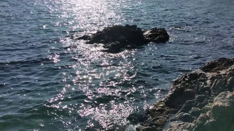Ocean lapping at a rock at Willows Stock Footage 190812662