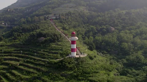 Ocean Lighthouse and Cliffs – Drone Perspective Stock Footage 328395398