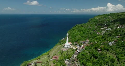 Ocean lighthouse perched on cliff with stunning aerial view Stock Footage 275822321