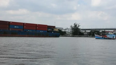 Ocean liner cargo ship in Chao Phraya river with Bhumibol Bridge at Thailand Stock Footage 167506203