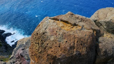 Ocean Mountain View from Behind Rock Tilt Up Stock Footage 96225652