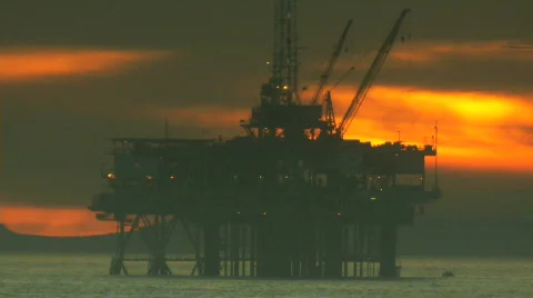 Ocean Oil Rig Time-lapse at Sunset Stock Footage