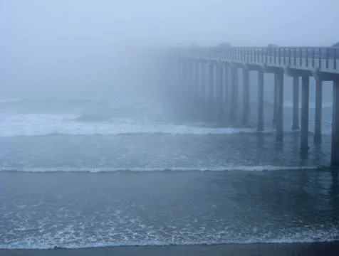 Ocean pier in the mist Stock Photos