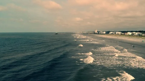 Ocean Pier Profile low flying cinematic Stock Footage 94634047
