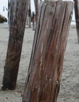 Ocean pier ruins single Stock Photos