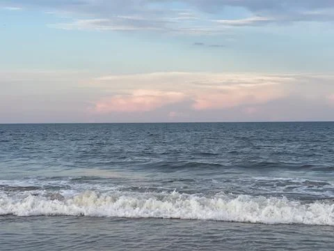 Ocean pink sunset Stock Photos