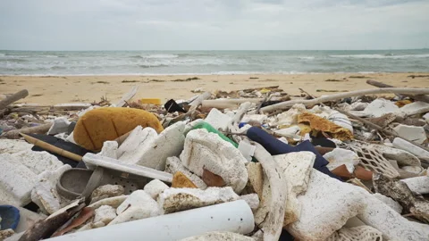 Ocean Pollution with Plastic Waste. A Lot of Plastic Debris and Other Waste Lies Stock Footage 278026466