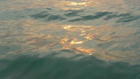 Ocean in the rays of the setting sun. Ocean shore in purple sunset. Twilight. Stock Footage 134122734