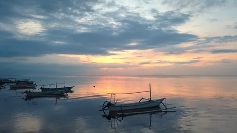 Ocean with reflections and boats camera moving towards sunset Stock Footage 94152619
