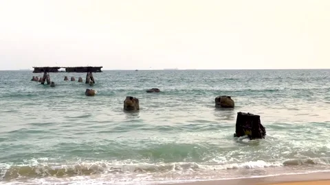 Ocean remnants of the Lome Abandoned Bridge Stock Footage 228209661