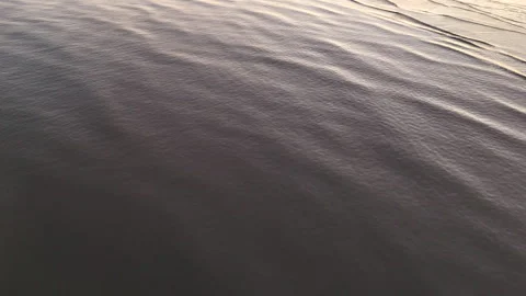 Ocean ripples on a calming winter evening Stock Footage 260817406