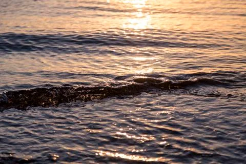 Ocean ripples at the sunset for backgrounds Stock Photos