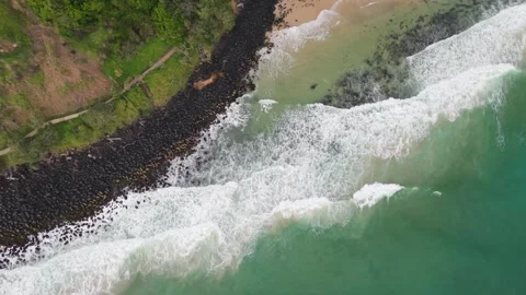 OCEAN ROCKS AND WAVES SEEN FROM ABOVE 스톡 동영상 325925260